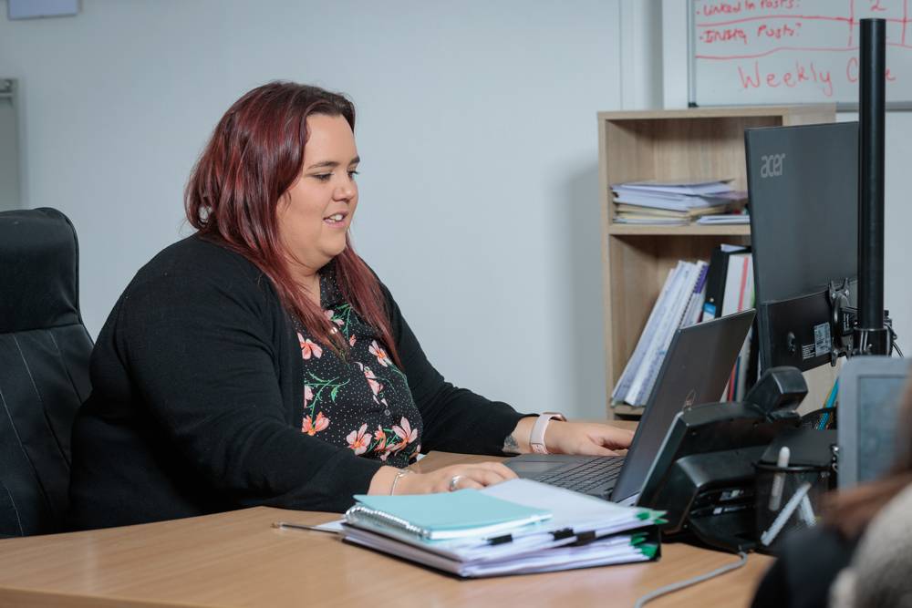 Rachael Fox, our Registered Manager, at her desk